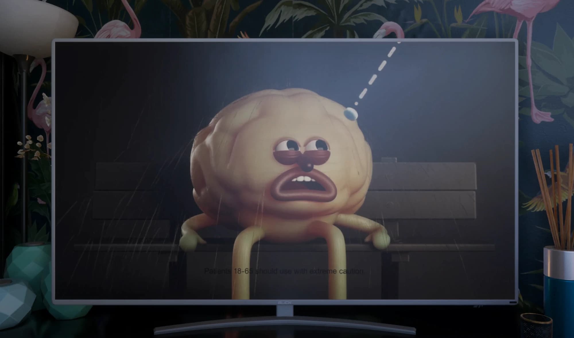 Pub de l’Angstipan à la télé : un cerveau triste avec des bras et des jambes, assis sur un banc sous la pluie